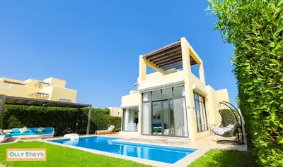 a villa with a swimming pool and a house at Tawila 4BR Villa Private Pool in Hurghada
