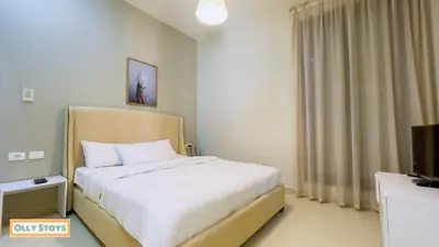 a bedroom with a bed and a television in it at Tawila 4BR Villa Private Pool in Hurghada