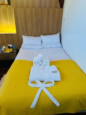 two towels on a bed with two pairs of scissors at Farida Djorf Palce in Luxor