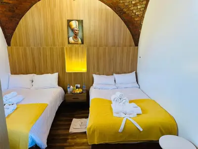 two beds with towels on them in a room at Farida Djorf Palce in Luxor