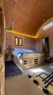 a bedroom with a large bed in a room at Massel Belosso in Aswan
