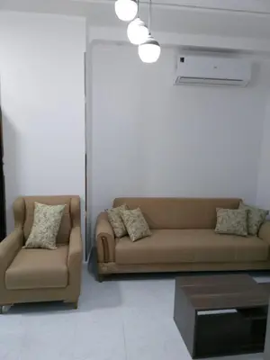 a living room with a couch and a coffee table at Dody apartments rent services in Luxor