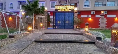 a entrance to a hotel with a blue door at منتجع اباظة السياحى in Hurghada