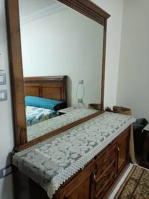 a mirror sitting on top of a bed in a room at Appartment in Hurghada in Hurghada
