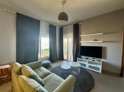 a living room with a couch and a table at waterside apartments in Hurghada