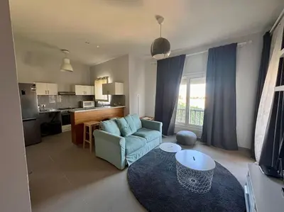 a living room with a couch and a table at waterside apartments in Hurghada