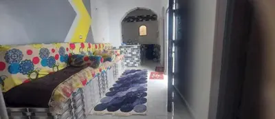 a room with a row of shoes on a wall at Rozan Guest house Aswan in Jazīrat Aswān