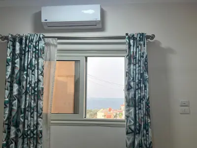 a window with a view of the ocean at Dream apartment2 in Hurghada