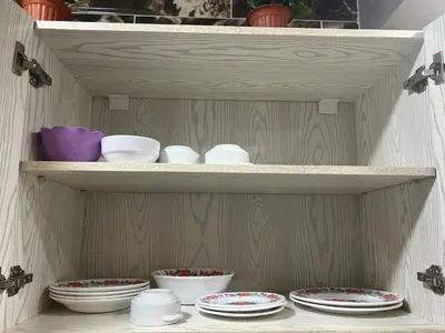 a wooden shelf with plates and bowls on it at Dream apartment2 in Hurghada
