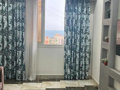 a room with a window with a view of the ocean at Dream apartment2 in Hurghada