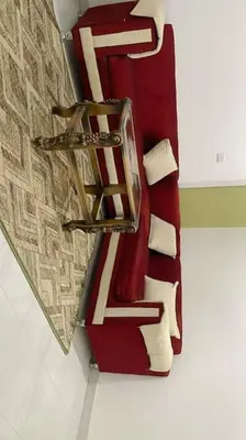 a room with a group of pillows on a wall at El Hady luxury apartment with swimming pool in Luxor