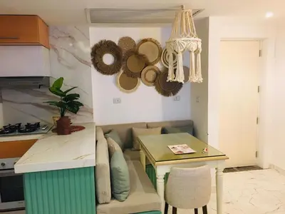 a kitchen with a couch and a table in a kitchen at Fanadir Bay in Hurghada