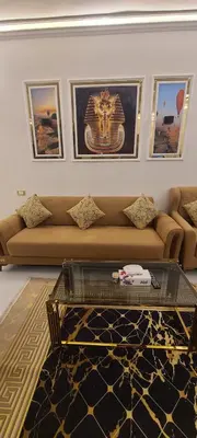 a living room with a couch and a glass table at Luxor Sapphire in Luxor
