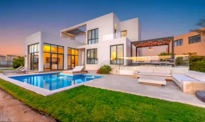 a house with a swimming pool in front of it at Luxury Villas in Tawila El Gouna in Hurghada