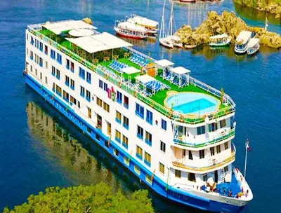 a cruise ship is docked in the water at Nile Cruise FB 3 Nights Aswan Luxor in Aswan