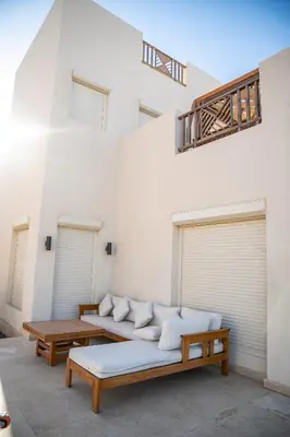 a living room with two couches and two tables at 4 Bedrooms, Luxury Villa Makadi Heights in Hurghada