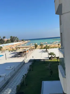 a view of the beach from a balcony of a resort at scandic resort sea view in Hurghada