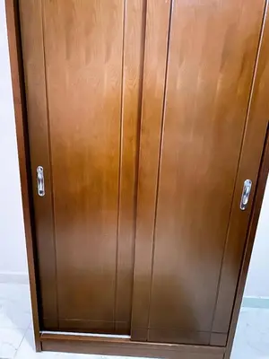 a brown cabinet with two metal doors on it at Tiba A F B View in Hurghada