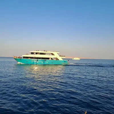 a large boat in the middle of the water at Tiba Golden Resort one bedroom in Hurghada