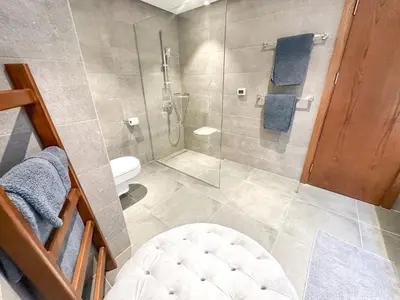 a bathroom with a shower and a toilet at Supreme Beachfront 3BR Villa Soma bay with Garden in Hurghada
