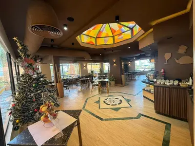 a lobby with a christmas tree in the middle of a room at Spacious 3BR Apartment - Al Dora Resort, Hurghada in Hurghada