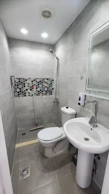 a bathroom with a toilet and a sink and a shower at White Roof - Hurghada in Hurghada
