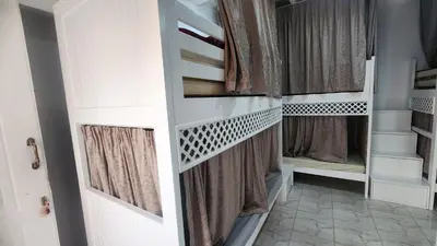 a walk in closet with curtains and a door at White Roof - Hurghada in Hurghada