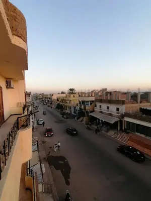 a view of a city street with cars on the road at Lutos Flower Apartment in Luxor