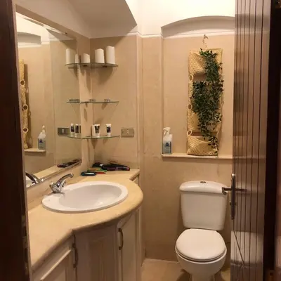 a bathroom with a toilet and a sink at one bedroom ground floor sabina elgouna in Hurghada