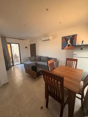a living room with a couch and a table at Aqua blue bay in Hurghada