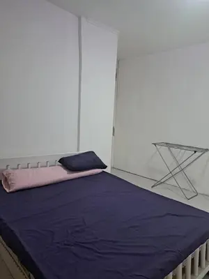 a bedroom with a bed with a purple blanket at Desert Bearl compound in Hurghada