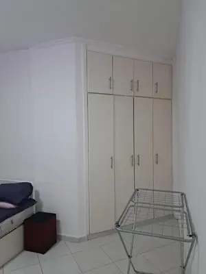a room with white cabinets and a metal rack at Desert Bearl compound in Hurghada