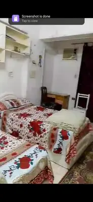 a room with two beds in a room at Aswan Lovely Apartment in Aswan