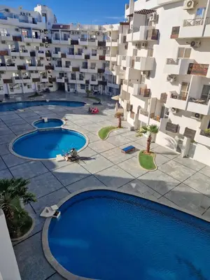 an aerial view of a building with two swimming pools at Tiba View in Hurghada