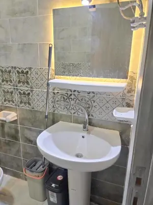 a bathroom with a white sink in a room at Porto Ghalib in Port Ghalib