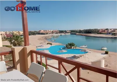 a balcony with a view of a body of water at Comfortable 1 Bedroom at Sabina El-Gouna Y160 in Hurghada