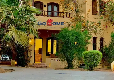 a building with a sign that says go home at Comfortable 1 Bedroom at Sabina El-Gouna Y160 in Hurghada