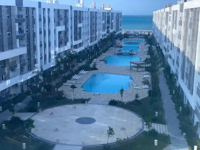 an aerial view of two pools in a building at Fanadir Bay Compound in Hurghada