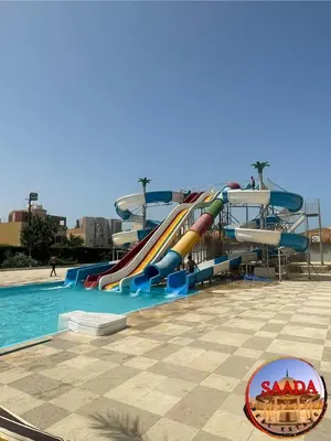 a water slide in a pool in a resort at Fanadir Bay Compound in Hurghada