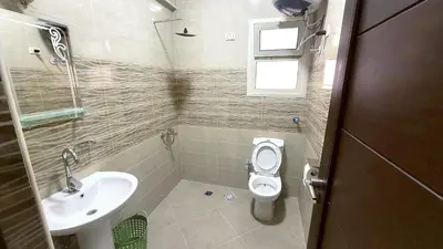 a small bathroom with a toilet and a sink at Andalusia Palace in Hurghada