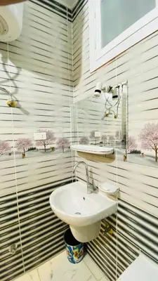 a bathroom with a sink and a mirror at Menna guest house in Luxor