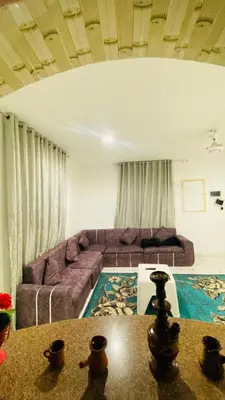 a living room with a couch and a table at Menna guest house in Luxor
