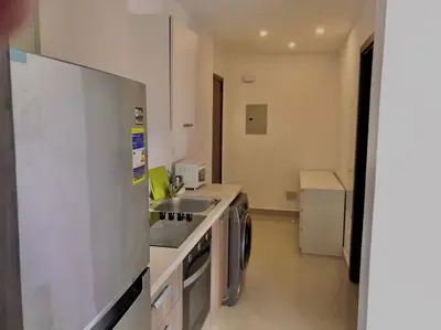 a kitchen with a sink and a stove top oven at Stunning 1-Bedroom in G Cribs in Hurghada