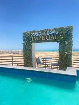 a swimming pool with a sign that reads one the zoo imperial at Imperial Resort Hurghada Studio pool view in Hurghada