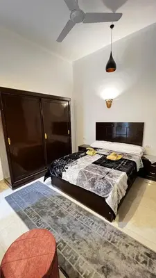 a bedroom with a large bed and a ceiling at Seti house in Luxor