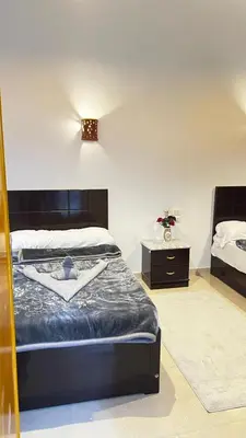 a bedroom with a bed and a dresser and a bed sidx sidx sidx sidx at Seti house in Luxor