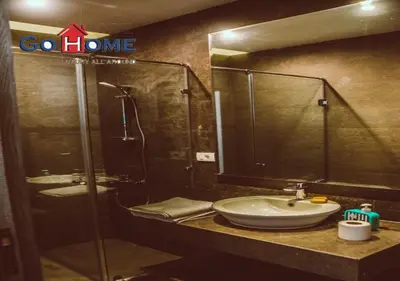 a bathroom with a sink and a shower at Cozy 3BR at Sholan with Private Heated Pool El-Gouna in Hurghada