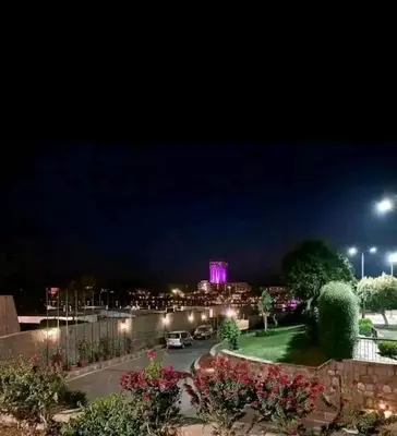 a view of the city at night at Hamoo guest House hotel in Aswan