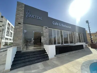 a store front of a cafe and restaurant at Beachfront Boho Style apartment in Fanadir Bay in Hurghada