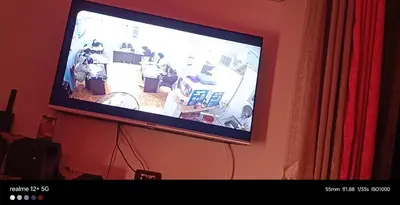 a flat screen tv hanging on a wall at Wintar guest house in Luxor